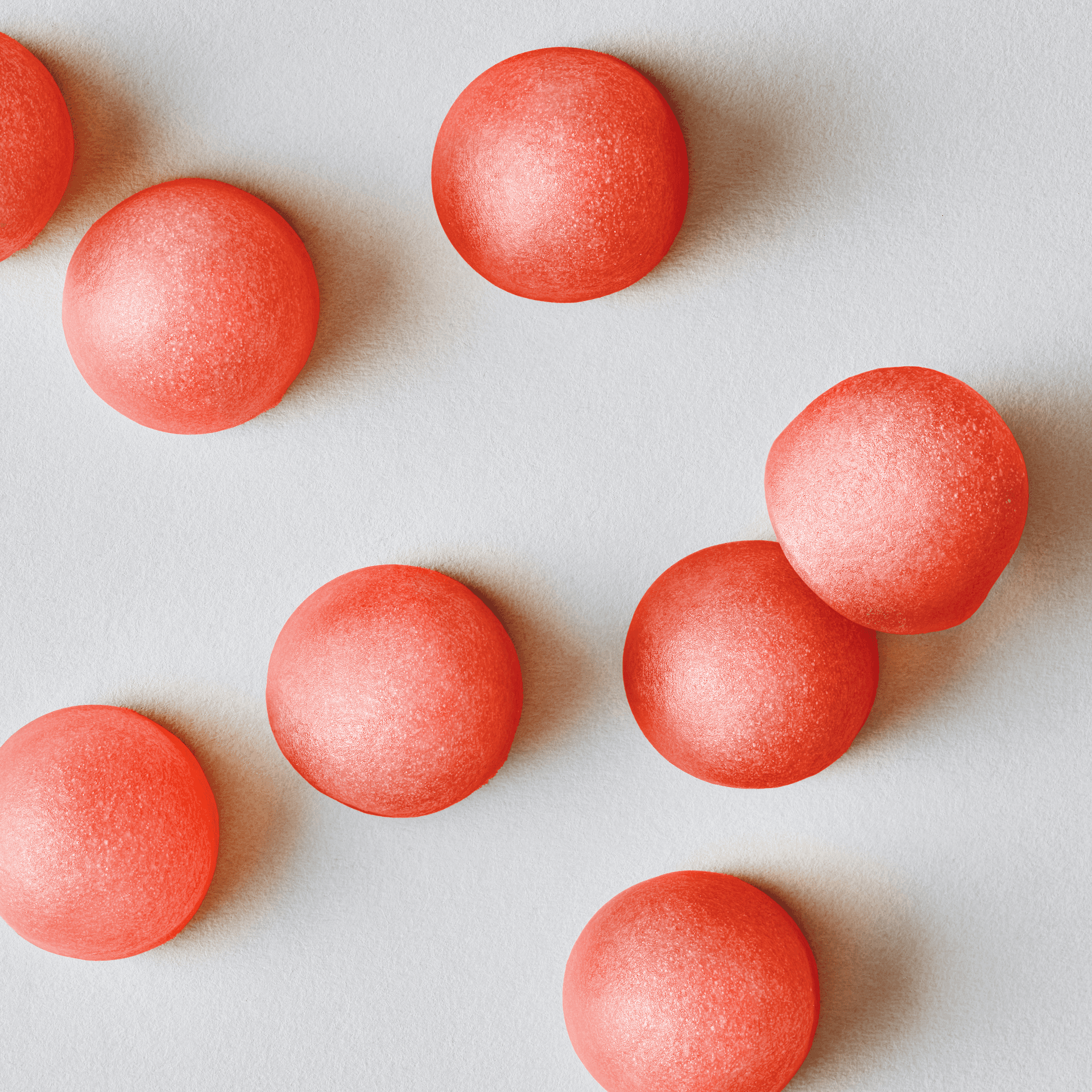 Multiple Sports Research Apple Cider Vinegar gummies laying on a flat surface.