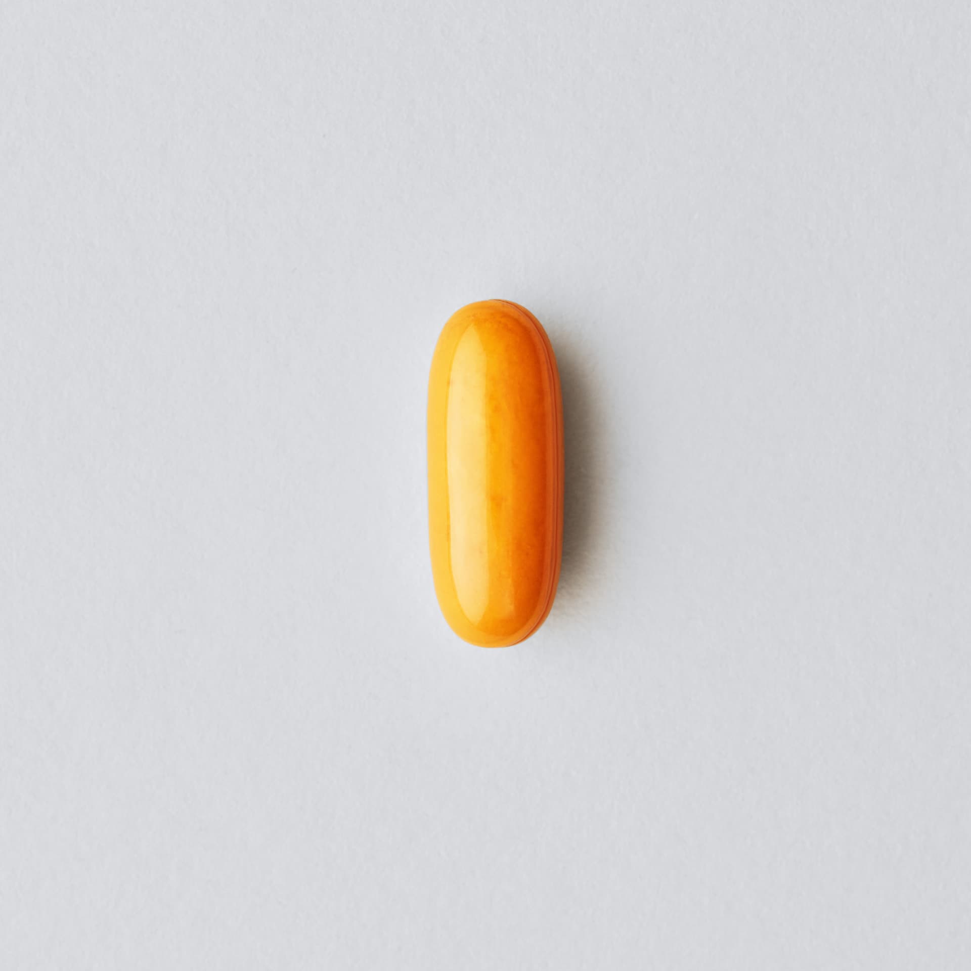 A single Sports Research Turmeric Curcumin softgel infographic.